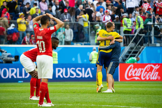 Players of Switzerland looks dejected while Viktor Claesson