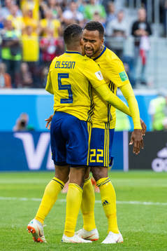 Martin Olsson and Isaac Kiese Thelin celebrate while