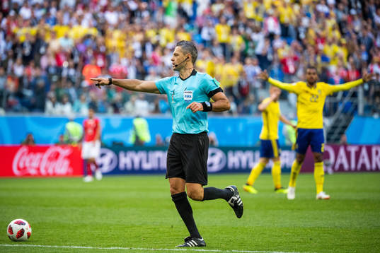 Referee Damir Skomina awards Sweden a penalty (later revoked