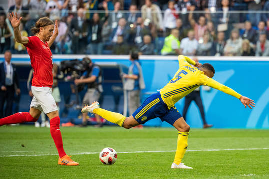 Martin Olsson falls and is awarded a penalty in a duel with