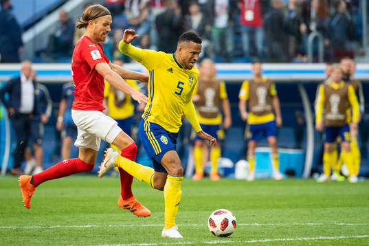 Martin Olsson falls and is awarded a penalty in a duel with