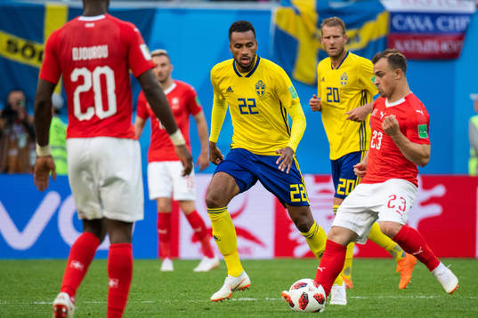 Isaac Kiese Thelin of Sweden and Xherdan Shaqiri of