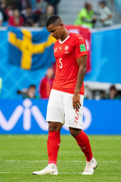 Manuel Akanji of Switzerland looks dejected