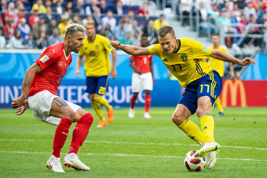Valon Behrami of Switzerland and Viktor Claesson of Sweden