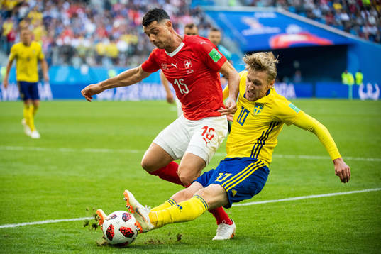 Blerim Dzemaili of Switzerland and Emil Forsberg of Sweden