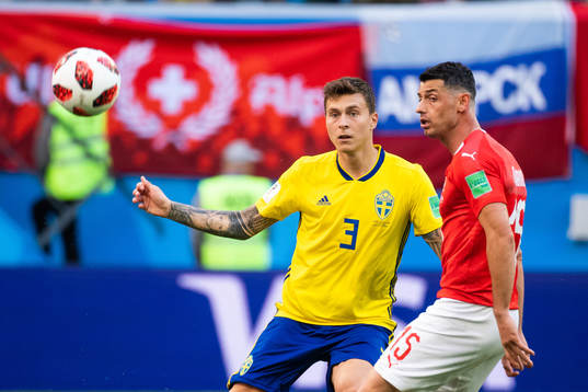 Victor Nilsson Lindelöf of Sweden and Blerim Dzemaili of