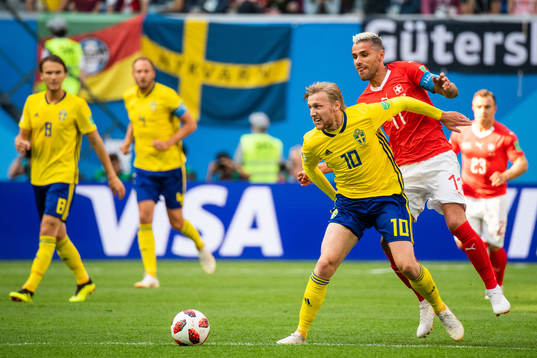 Emil Forsberg of Sweden and Blerim Dzemaili of Switzerland