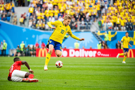 Johan Djourou of Switzerland tackles Emil Forsberg of Sweden