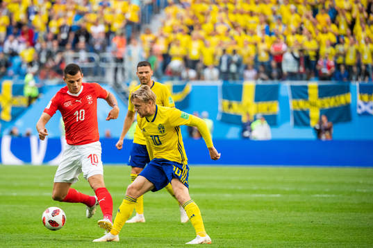 Granit Xhaka of Switzerland and Emil Forsberg of Sweden