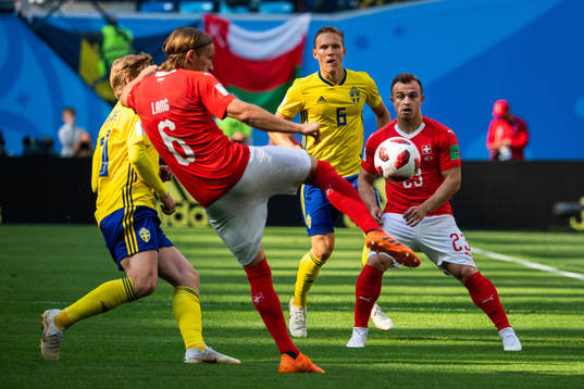 Ludwig Augustinsson of Sweden and Xherdan Shaqiri of