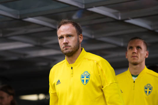 Andreas Granqvist and goalkeeper Robin Olsen of Sweden