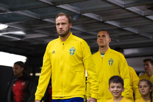 Andreas Granqvist and goalkeeper Robin Olsen of Sweden