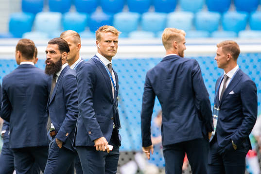Oscar Hiljemark of Sweden inspects the pitch prior to the