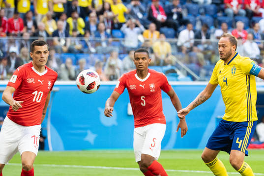 Granit Xhaka and Manuel Akanji competes for the ball with