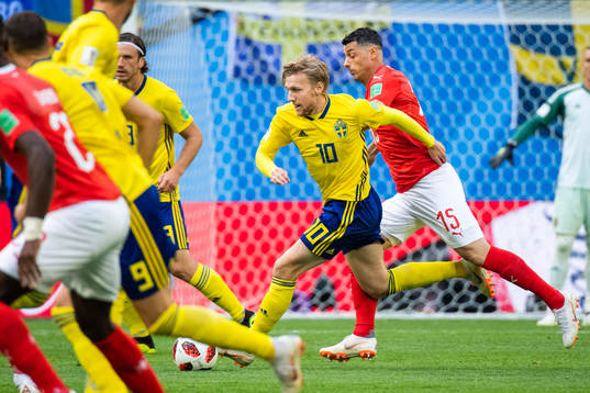 Emil Forsberg of Sweden competes for the ball with Blerim