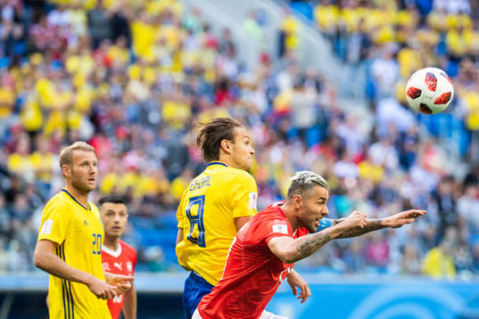 Albin Ekdal of Sweden competes for the ball with of