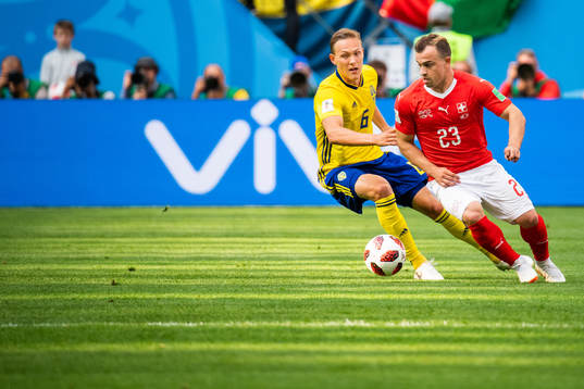 Ludwig Augustinsson of Sweden and Xherdan Shaqiri of