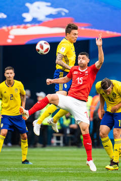 Victor Nilsson Lindelöf of Sweden and Blerim Dzemaili of