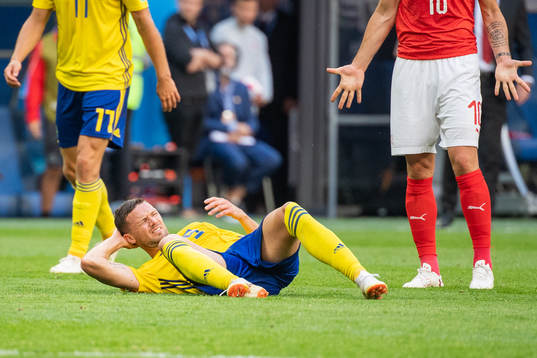 Marcus Berg of Sweden lies down