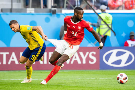 Marcus Berg of Sweden and Johan Djourou of Switzerland