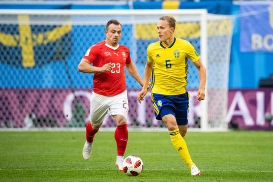 Xherdan Shaqiri of Switzerland and Ludwig Augustinsson of