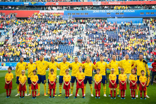 Players of Sweden sings the national anthem prior to the