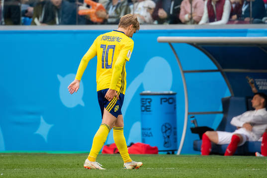 Emil Forsberg reaches for the backside of his thigh as he