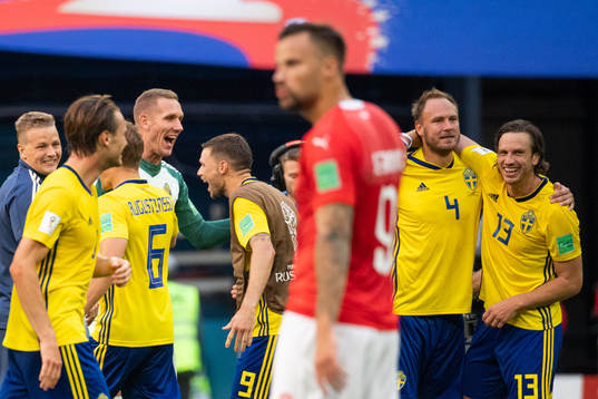 goalkeeper Robin Olsen and Marcus Berg of Sweden celebrates