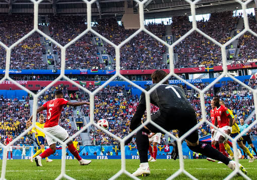 Emil Forsberg of Sweden scores 1-0 behind goalkeeper Yann