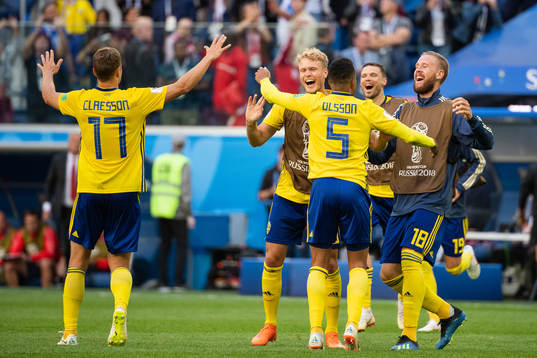 Oscar Hiljemark and Pontus Jansson celebrate with Martin