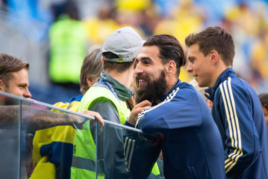 Jimmy Durmaz of Sweden talks to relatives