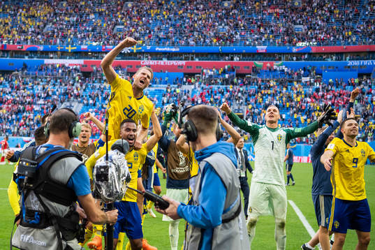Ola Toivonen and Isaac Kiese Thelin of Sweden celebrate