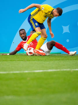 Johan Djourou of Switzerland competes for the ball with