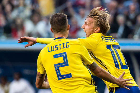 Emil Forsberg of Sweden celebrates with Mikael Lustig