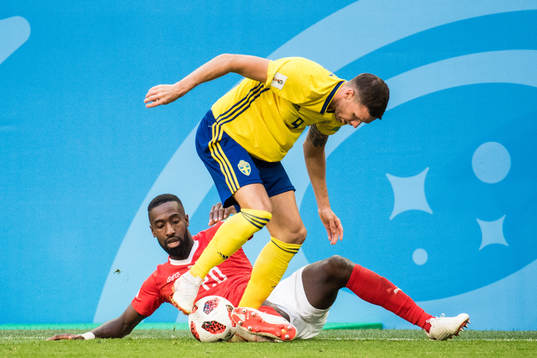 Marcus Berg of Sweden and Johan Djourou of Switzerland