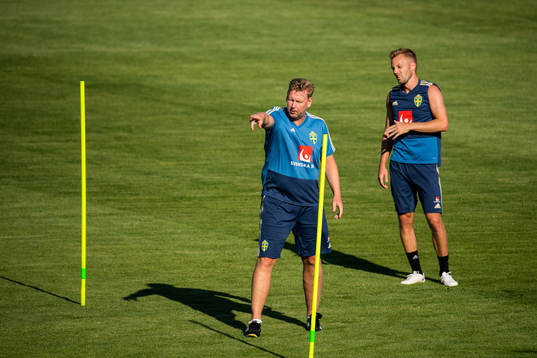 Assistant coach Peter Wettergren and Sebastian Larsson of