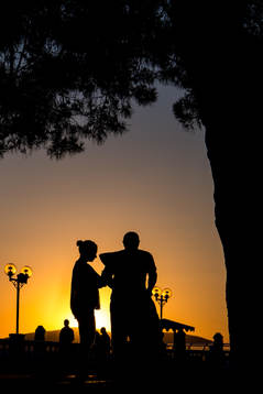 People walks in the sunset