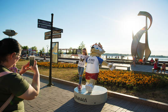 People take images in front of the FIFA 2018 World Cup