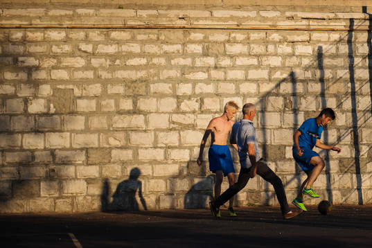 People play football
