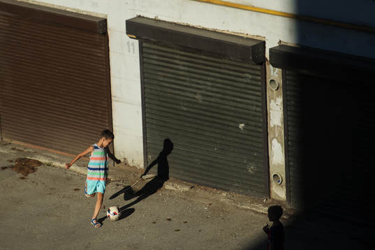 Kids play football