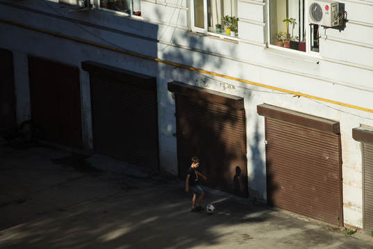 A kid plays football