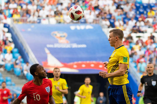 Raheem Sterling of England and Emil Krafth of Sweden