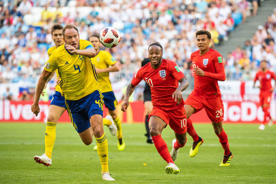 Andreas Granqvist of Sweden and Raheem Sterling of England