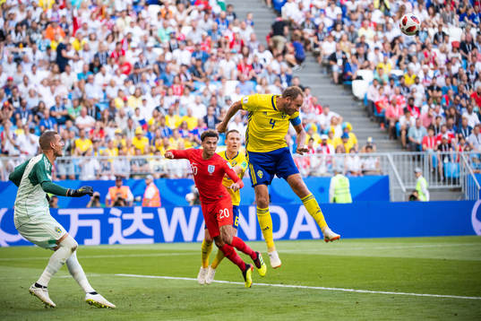 Andreas Granqvist of Sweden clears the ball in front of