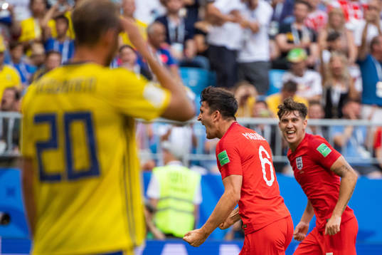 Ola Toivonen of Sweden looks dejected while Harry Maguire