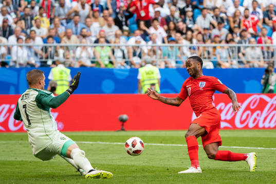 Goalkeeper Robin Olsen of Sweden and Raheem Sterling of