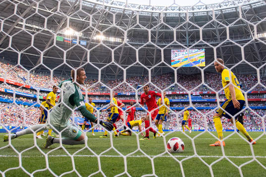 Goalkeeper Robin Olsen and Ola Toivonen watches as Harry