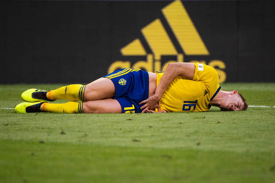 Emil Krafth of Sweden lies down