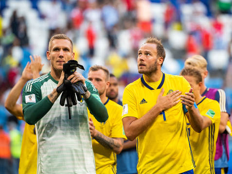 goalkeeper Robin Olsen and Andreas Granqvist of Sweden