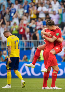 John Guidetti of Sweden look dejected while Harry Maguire